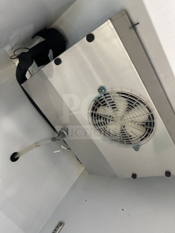 Turbo Air TGM-23SDW commercial fridge interior detail, showing fan and wiring. Brand new condition, single glass door model.