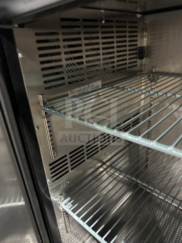 Brand new Avantco 48" black stainless steel 2-door back bar cooler, model 178UBB48HC, with poly-coated wire racks.