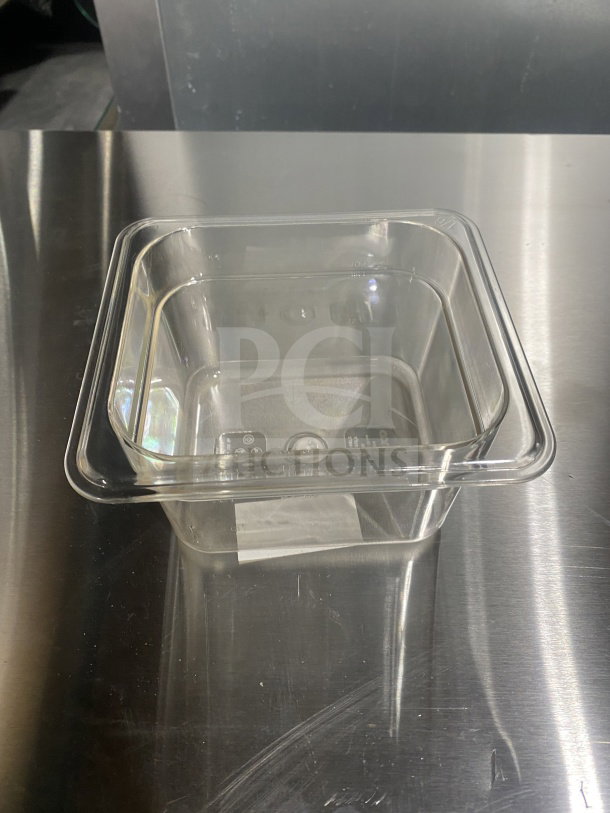 Brand new Winco SP7604 1/6 size polycarbonate food pan. Transparent, commercial-grade, serial number 30811642002755.