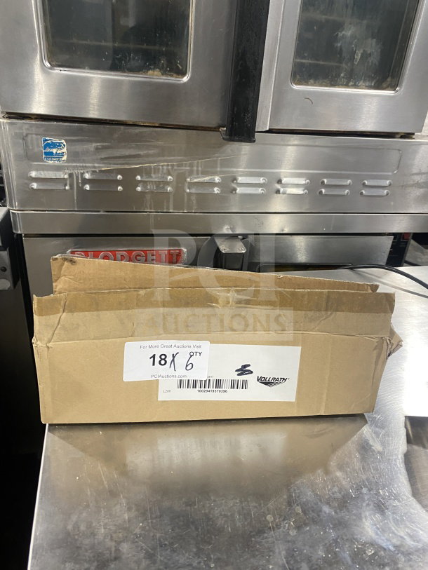 Cardboard box containing new Volrath 1 oz. black solid round stainless steel spoodle, Model 61147. "Grip 'N Serve" handle. Visible brand tag.