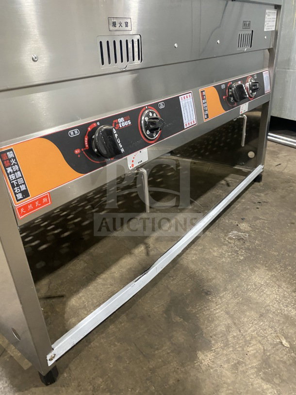 Brand new Gaoji Gorgeous MHGF2T46F stainless steel double tank gas fryer on legs, pristine condition, control panel visible.