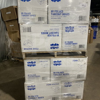 Americareroyal FTB3BK takeout boxes stacked on pallets. Model: FTB3BK, 66 oz capacity, black color, commercial size.