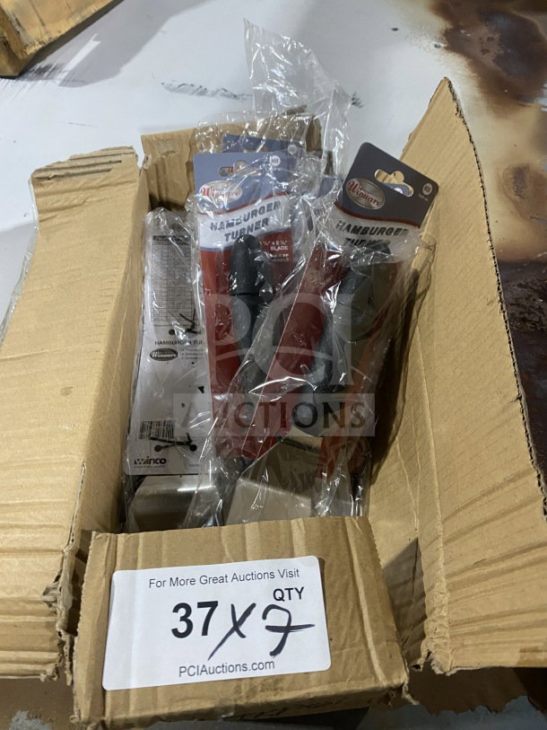 Brand new Winco Winware Series stainless steel hamburger turner, Model TKP61, in packaging, quantity 7, in box.