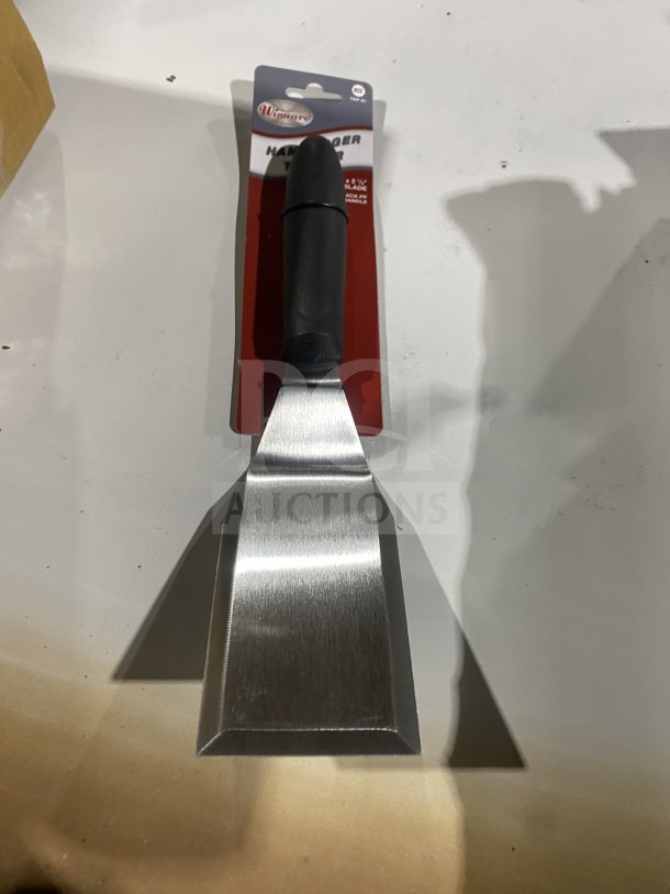 Brand new Winco Winware TKP-61 stainless steel hamburger turner, 8.25" blade, black handle, in original packaging.