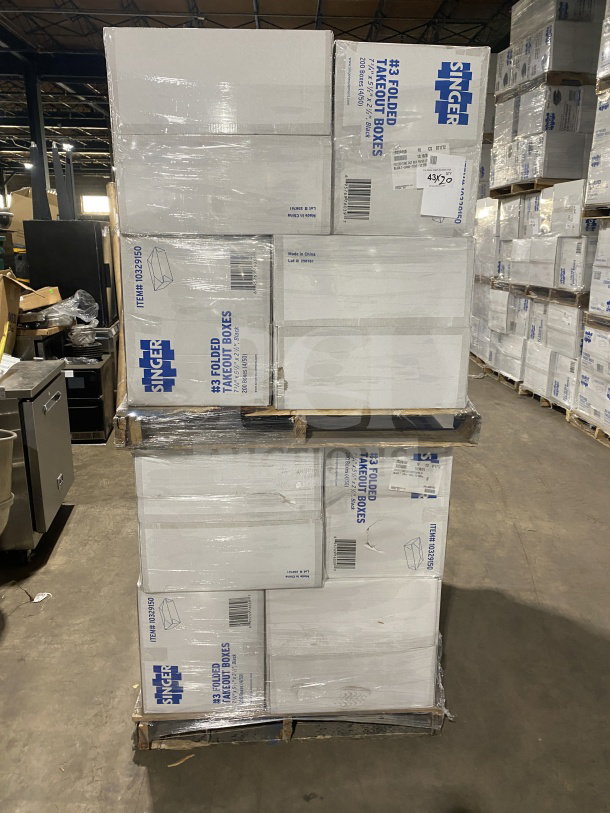 Brand new AmeriCareRoyal FTB3BK takeout boxes, 7.15x5.5x2.5", black, stacked on pallets.