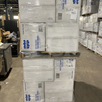 Brand new AmeriCareRoyal FTB3BK takeout boxes, 7.15x5.5x2.5", black, stacked on pallets.