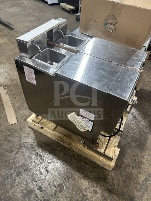 Brand new Taylor RD30-12 stainless steel frozen beverage dispenser, dual-flavor, electric, 115V, 1 phase, pristine condition.