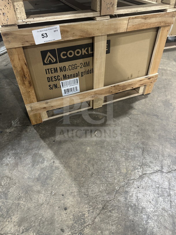 New CookLine 24" stainless steel gas countertop griddle, model CGG-24M, with manual controls. Serial number 745064364.