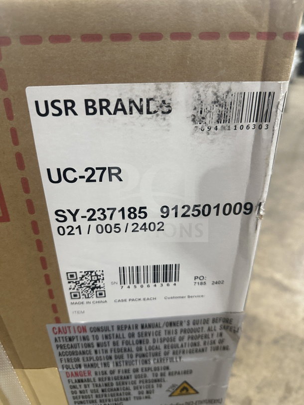 Cardboard box with markings indicating CookLine 24" Commercial Stainless Steel Gas Griddle, Model CGG-24M, SN: 745064364.