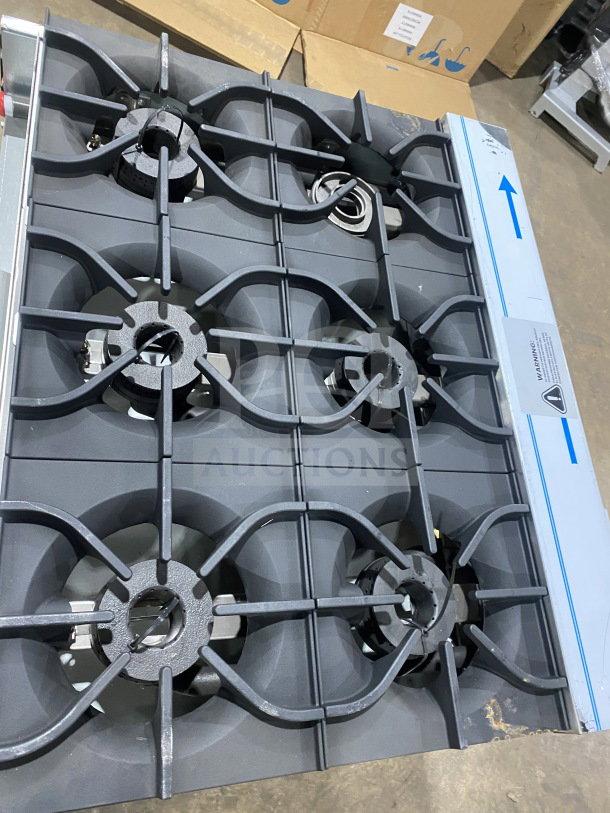 Kutano 36" commercial stainless steel 6-burner range, model KUT6BRN36NG, natural gas, new condition, on legs.