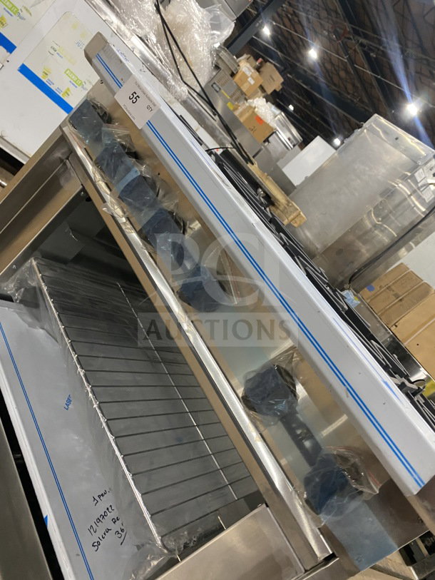 Brand new Kutano 36" 6-burner range, model KUT6BRN36NG, natural gas, stainless steel, with oven and chrome rack.