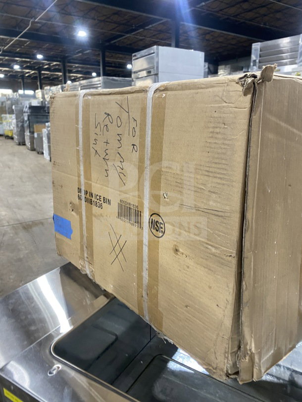 BRAND NEW! Commercial stainless steel drop-in ice bin with sliding lid. Box marked "Drop-In Ice Bin; Model B181836." Box shows wear.