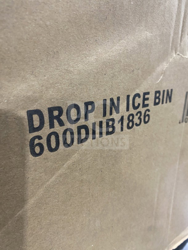 Brand new commercial stainless steel drop-in ice bin with sliding lid, model 600DIIB1836, in original packaging.