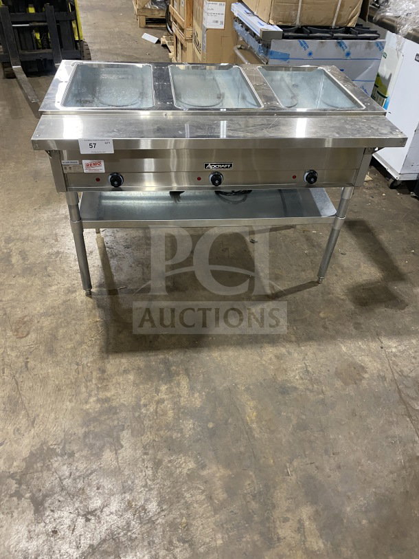 Adcraft stainless steel 3-pan steam table, model ST1203, new condition, with undershelf storage and electric power, 120V.