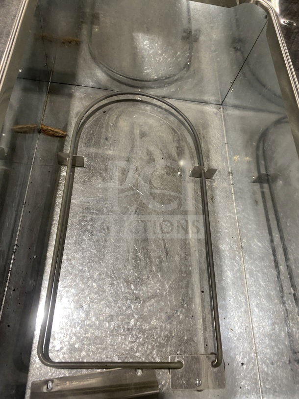 Adcraft stainless steel electric steam table interior, model ST1203, new condition, 3-pan capacity, undershelf storage.