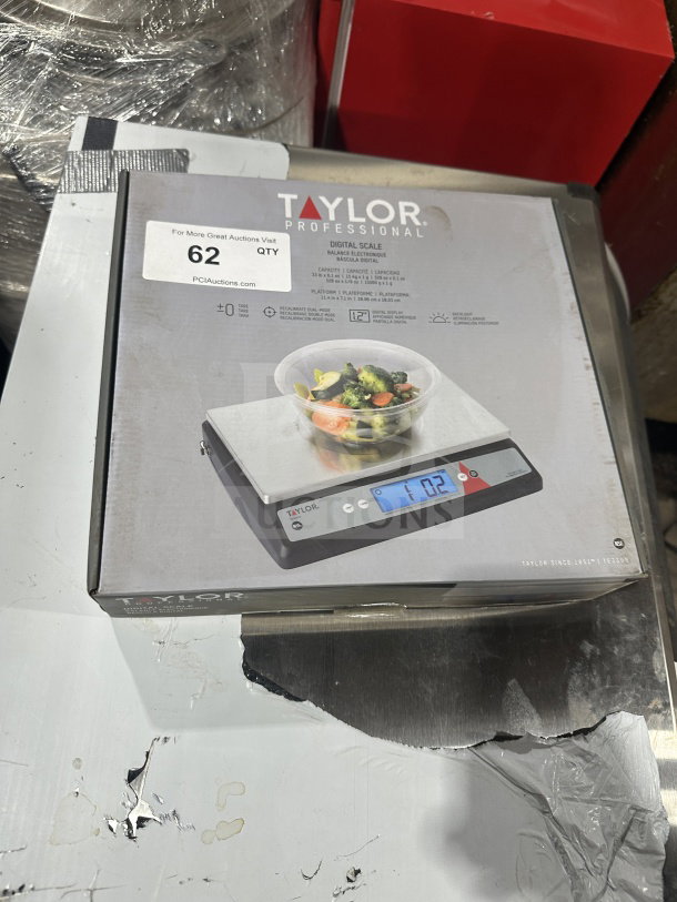 Brand new Taylor Commercial Stainless Steel Oversize Platform Digital Portion Control Scale in box, model details visible.