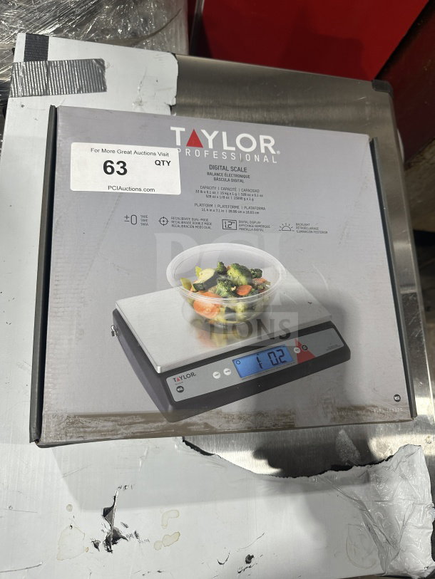 BRAND NEW Taylor Commercial Stainless Steel Oversize Platform Digital Portion Control Scale in box; model details visible on packaging.