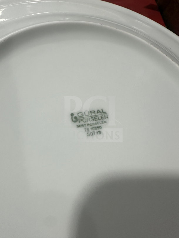BRAND NEW Turgla 11" white porcelain dinner plate, Model D128DU00, with rolled edge and wide rim. Marked "Güral Porselen."
