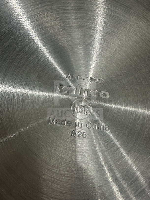Winco 10" stainless steel non-stick fry pan, model AFP-0NS. Engraved with "Winco," "NSF," and "Made in China" markings.