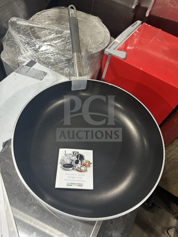 Brand new Winco-Winware 10" stainless steel non-stick fry pan, model AFP0NS, commercial grade, with tags.