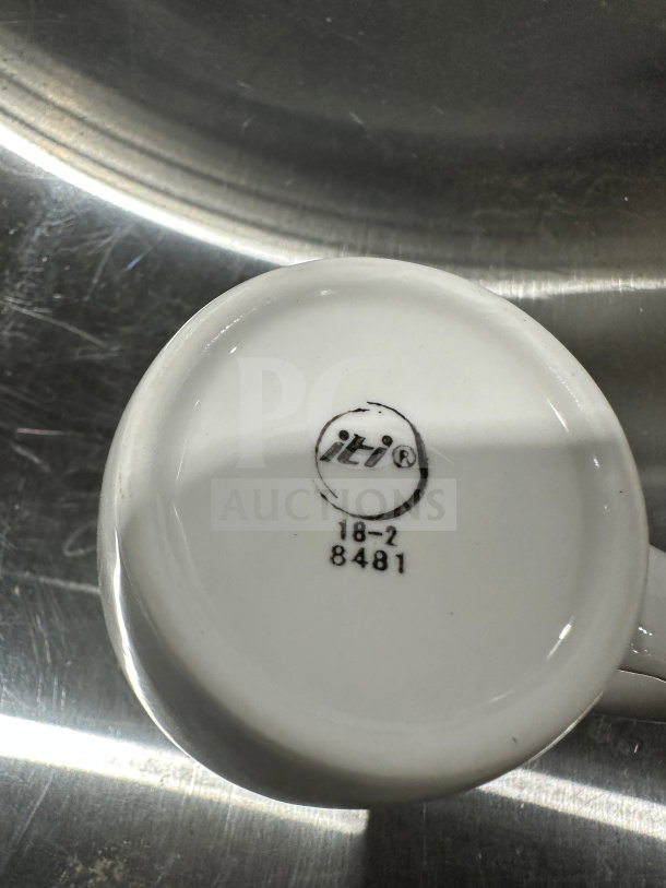 Brand new Iti Commercial 12 oz porcelain white mug, model CP8481. Logo and model number printed underneath.