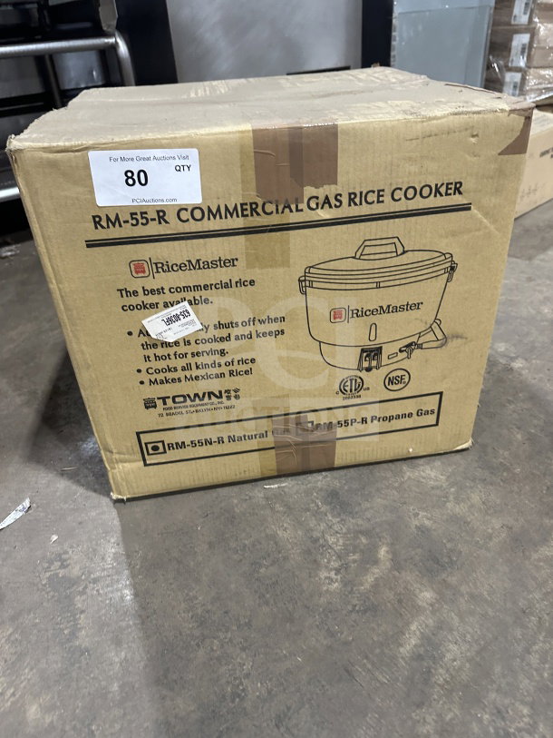 Brand new Town RM-55-R commercial stainless steel natural gas rice cooker, 110 cup capacity. Box shows labels and specs.
