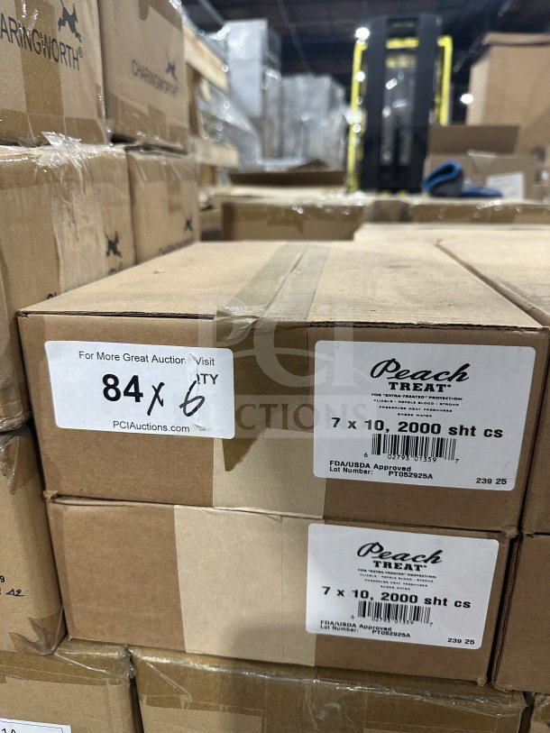 Brand new Peach Treat 7x10" steak paper sheets, 2,000 per case, shown in boxes. FDA/USDA approved. Lot number PT0529225A.