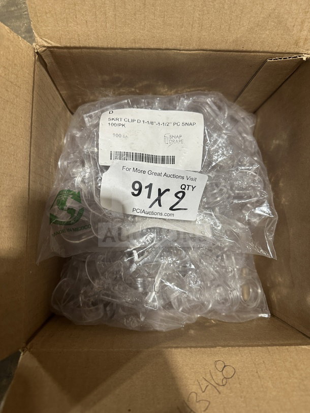 Brand new Snap commercial clear polycarbonate plastic drape skirt clips, pack of 100, labeled 1-1/8"-1-1/2", made in Mexico.