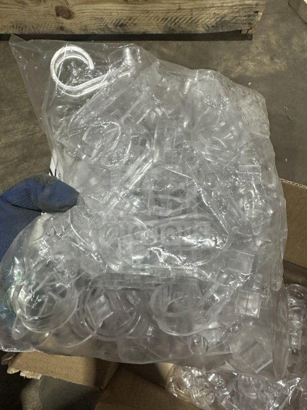 Brand new Snap polycarbonate plastic drape skirt clips in clear, 100 per pack, sealed in original packaging.