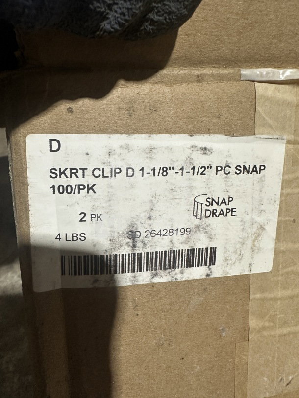 Box of Snap brand clear polycarbonate drape skirt clips, 100 per pack. New, labeled with size 1-1/8" to 1-1/2".