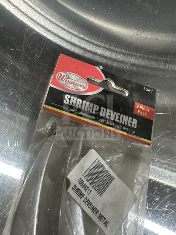 Brand new Winware SDA-7 aluminum shrimp deveiner, 2-piece pack. Packaging shows brand and model details.