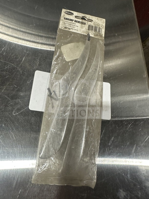 Brand new Winware Aluminum Shrimp Deveiner, Model SDA-7, in packaging. Includes two pieces per pack.