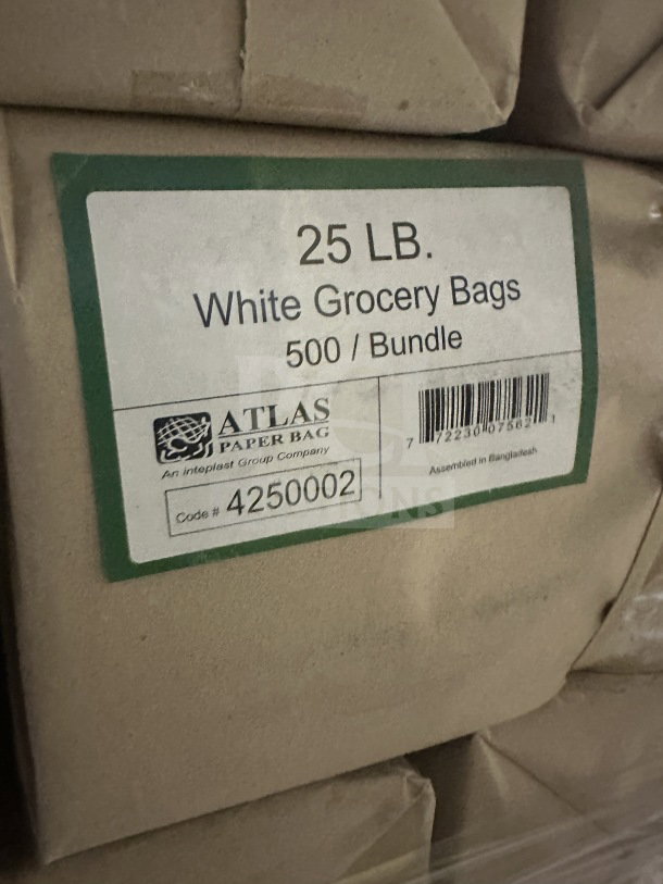 Alt Text: Bundle of Atlas 25 LB white grocery bags, model 4250002, 500 per box, new condition, labeled with barcode and details.