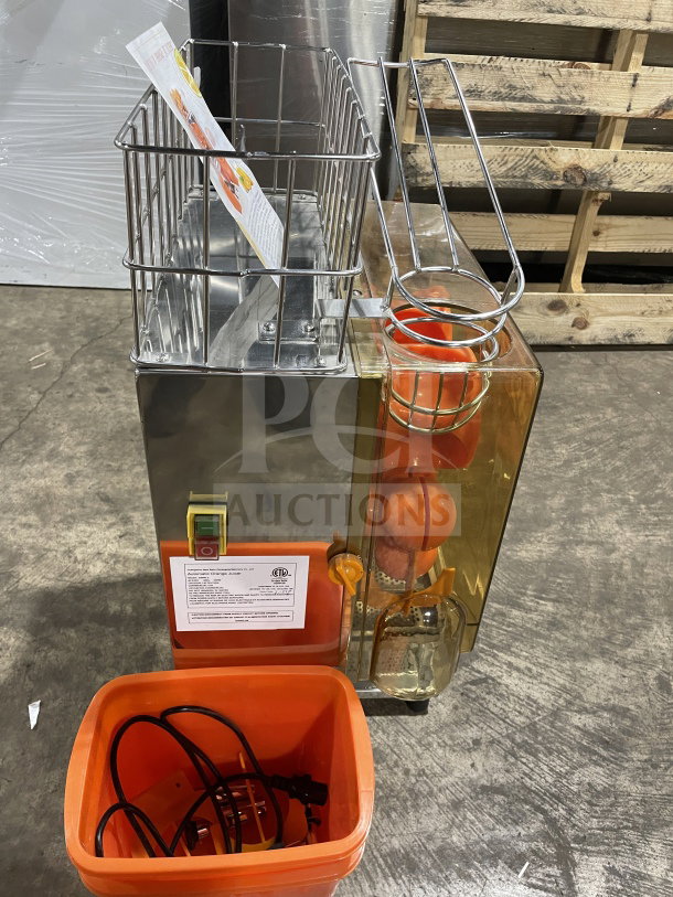 New Zumex 2000E-2 Commercial Orange Juicer, electric powered, 120V, countertop model, features stainless steel and orange components.