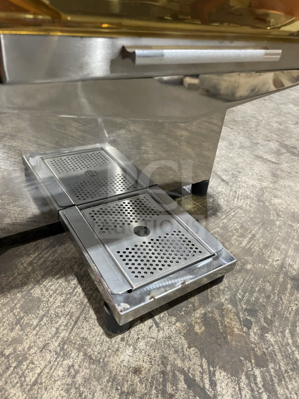 Zumex 2000E-2 commercial electric orange juicer, brand new, stainless steel with a perforated drip tray, 120V.