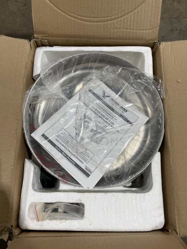 Brand new American Eagle AE-G12N stainless steel meat grinder in box, including manual and accessories.