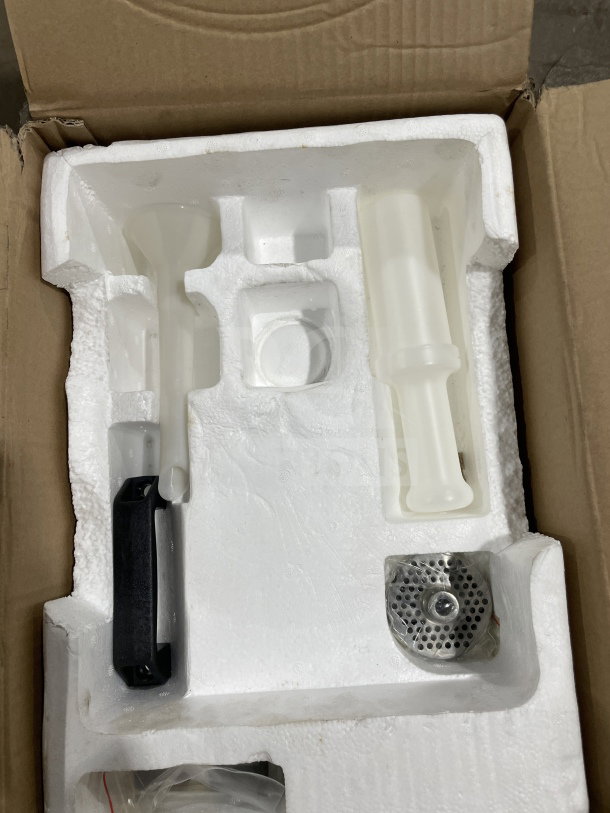 Brand new American Eagle AE-G12N stainless steel meat grinder in original packaging. Includes attachments, box open.
