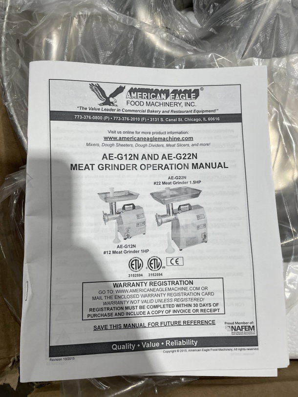 Brand new American Eagle AEG12N meat grinder, heavy-duty stainless steel, includes manual, pristine condition.