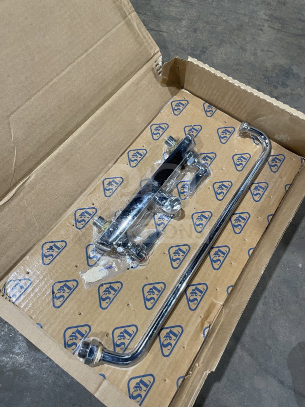Brand new T&S commercial brass wall-mount workboard mixing faucet with a 12" swing nozzle in original packaging.