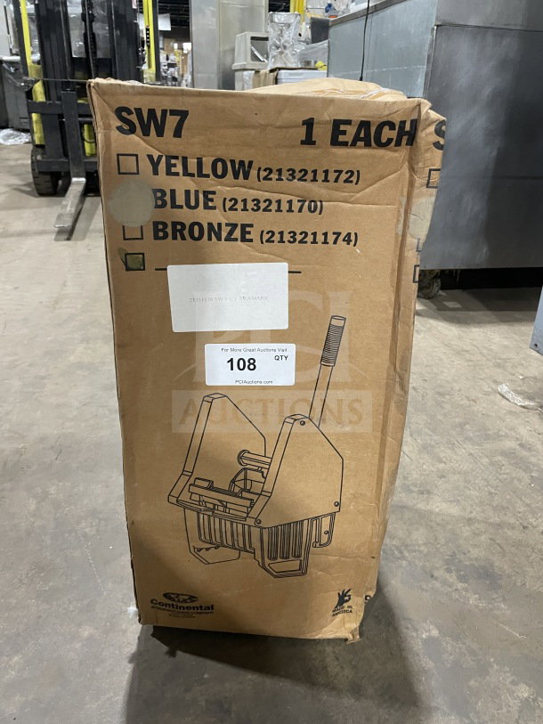 Brand new Continental Commercial splash guard down-press wringer in original packaging. Box shows product image and specifications.