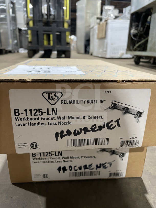 Brand new T&S B-1125-LN wall-mounted workboard faucet in box, 8" centers, lever handles, no nozzle. Model tag visible.