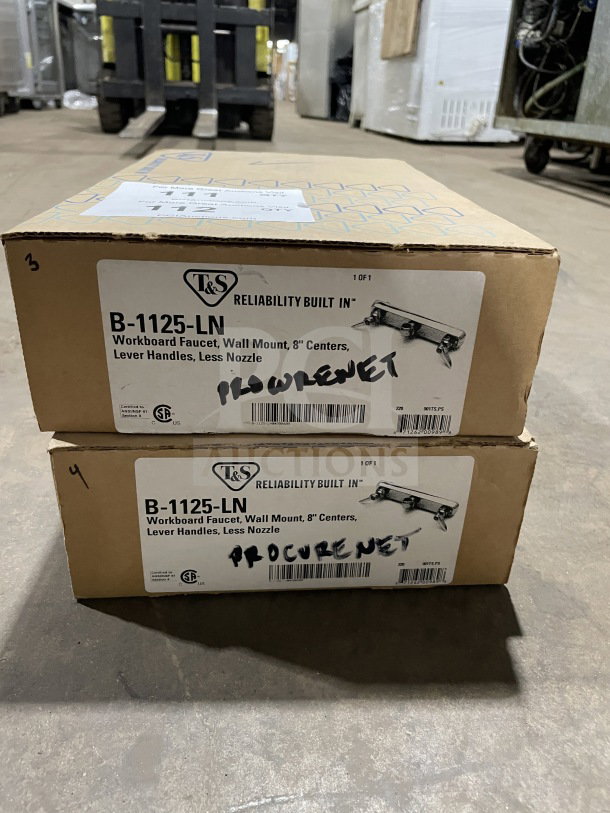 Brand new T&S B-1125-LN wall-mounted workboard faucet box, lever handles, 8" centers, less nozzle, in original packaging.