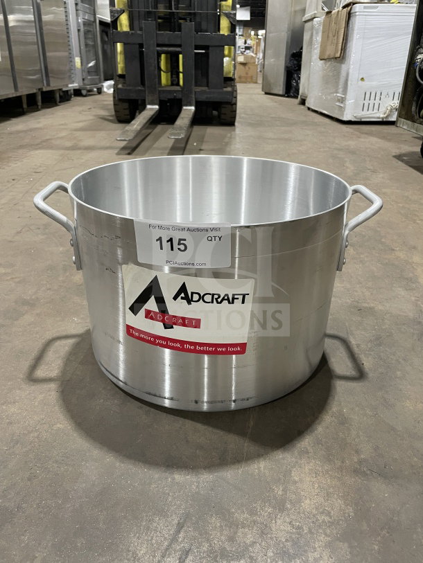 Brand new Adcraft commercial heavy-duty aluminum sauce pot with handles. Features label indicating model and auction lot.