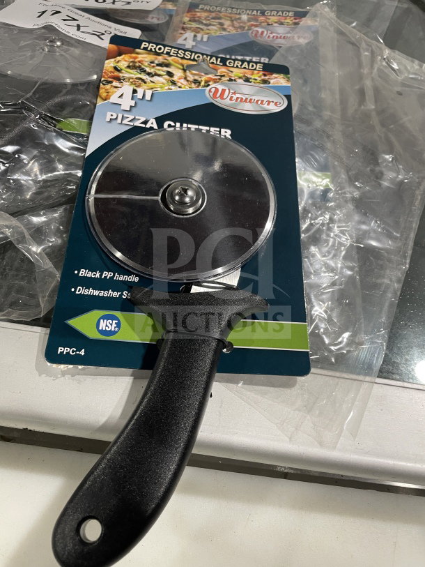 Winco 4" stainless steel pizza cutter, model PPC-4, black plastic handle, new in package, dishwasher safe, NSF certified.