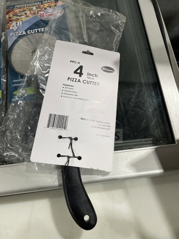Brand new Winco PPC-4, 4" stainless steel pizza cutter with black plastic handle. Model PPC-4. NSF listed, dishwasher safe.