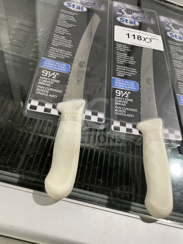 Winco Stal Series KWP91 commercial bread knife, new, 9.5" wavy edge, white PP handle, German steel, in packaging.