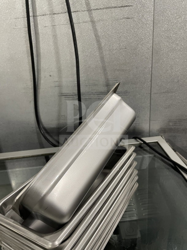 Brand new Thunder Group STPA3142 stainless steel steam table pans stacked, commercial use, pristine condition.