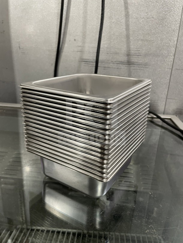 Brand new Amko stainless steel half-size steam table pans, Model 24602, stacked, mint condition, SN: 608819481654.