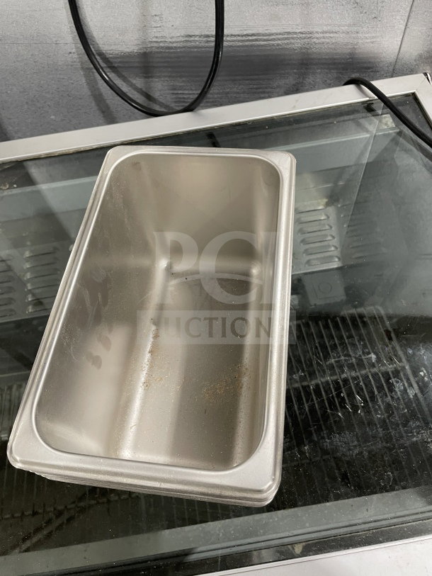 Amko 24406 quarter-size steam table pan in stainless steel, brand new condition, visible markings, ideal for commercial use.