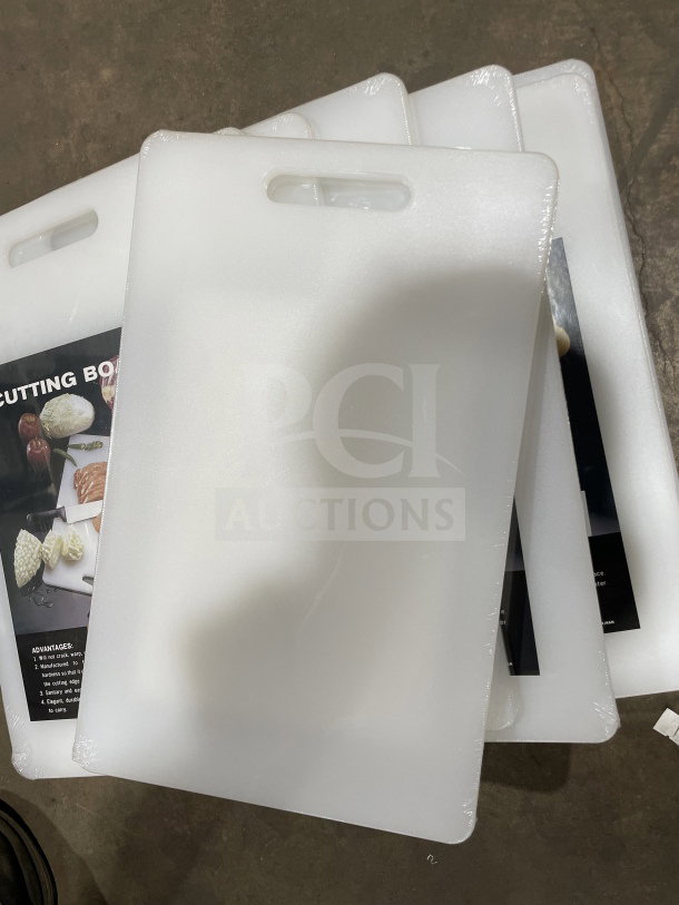 Brand new Thunder Group PLCB002 white plastic cutting boards with handle holes, non-skid feature, wrapped in packaging.